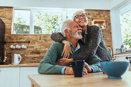 Happy retired couple embracing